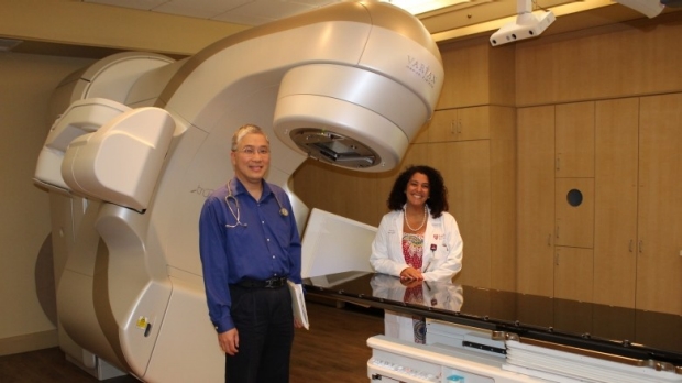 Zaky and Luu pose with the Linear accelerator